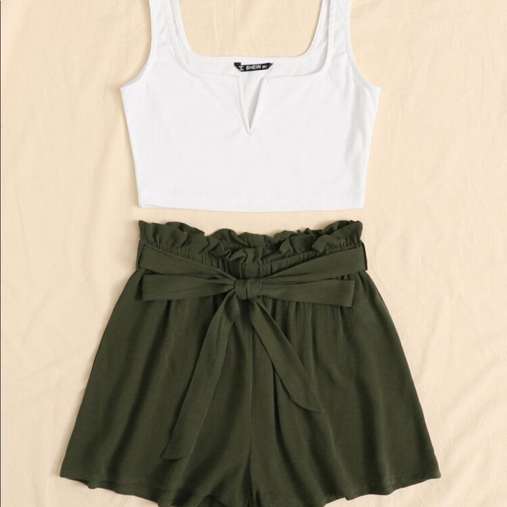 Notched neck tank top and paper bag waist shorts.